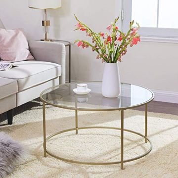 Table basse en verre avec structure en acier doré : Élégante et durable